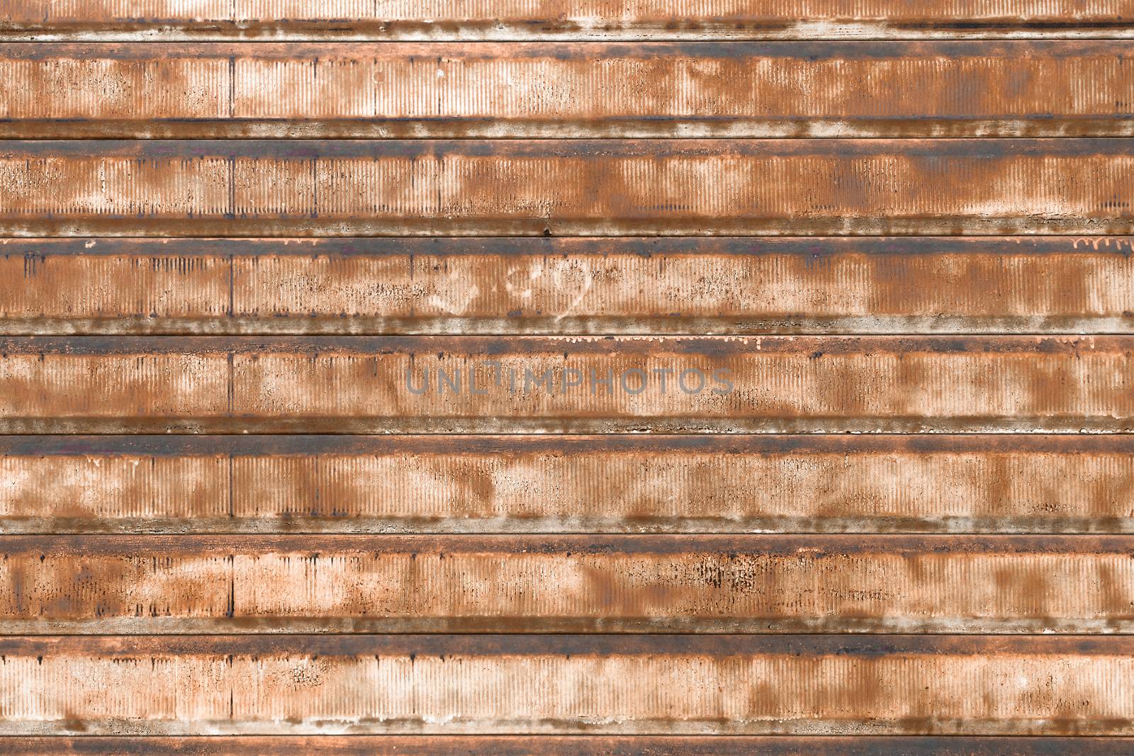 Front view of an old rusty gate, lowered forever.