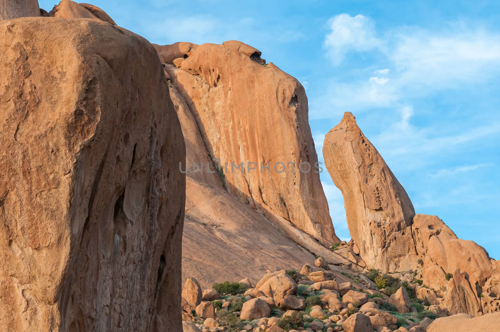 A granite needle and rock formation resembling a baboon face at the greater Spitzkoppe