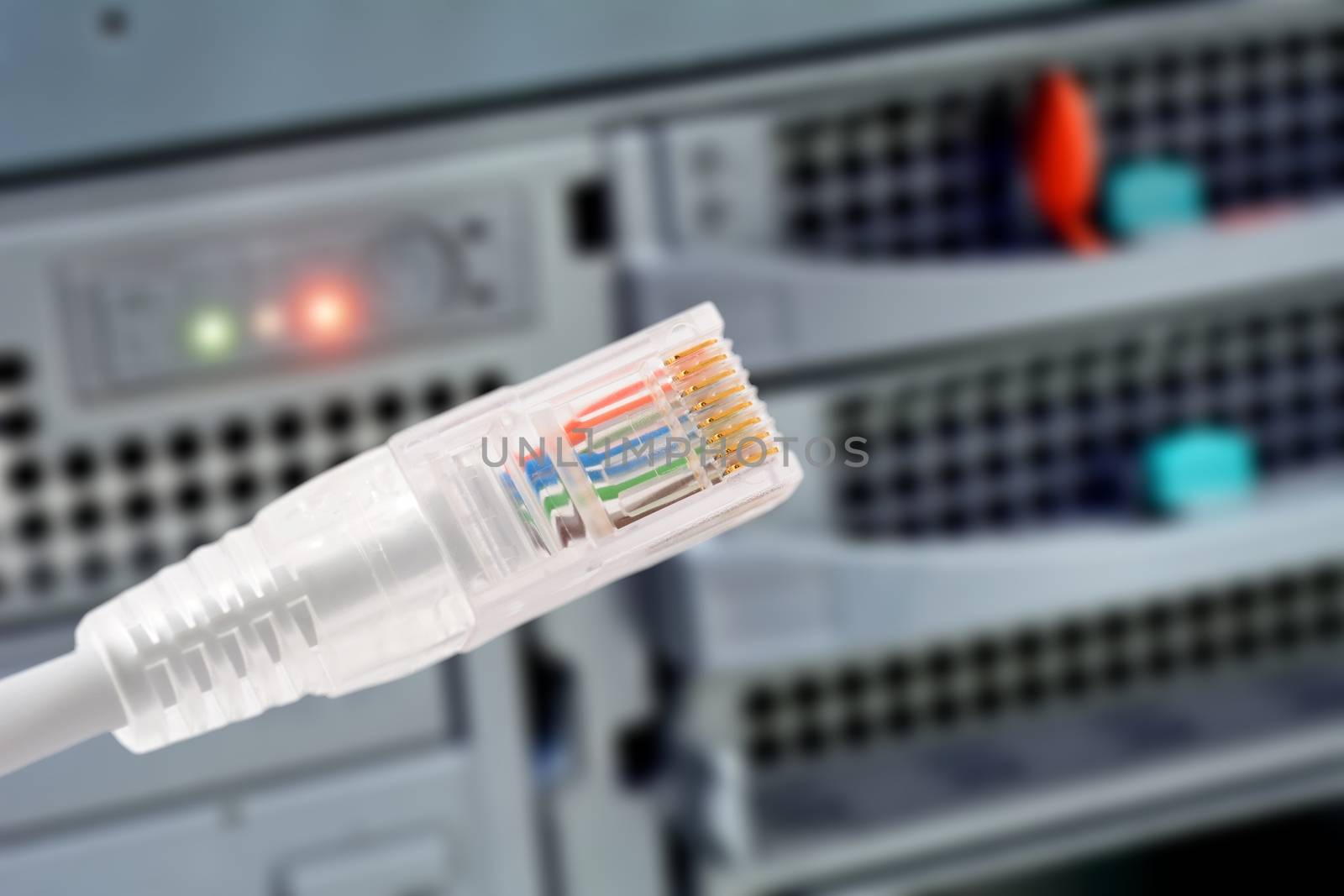 Data connection with rj45 patch cable, conceptual shot. by hamik