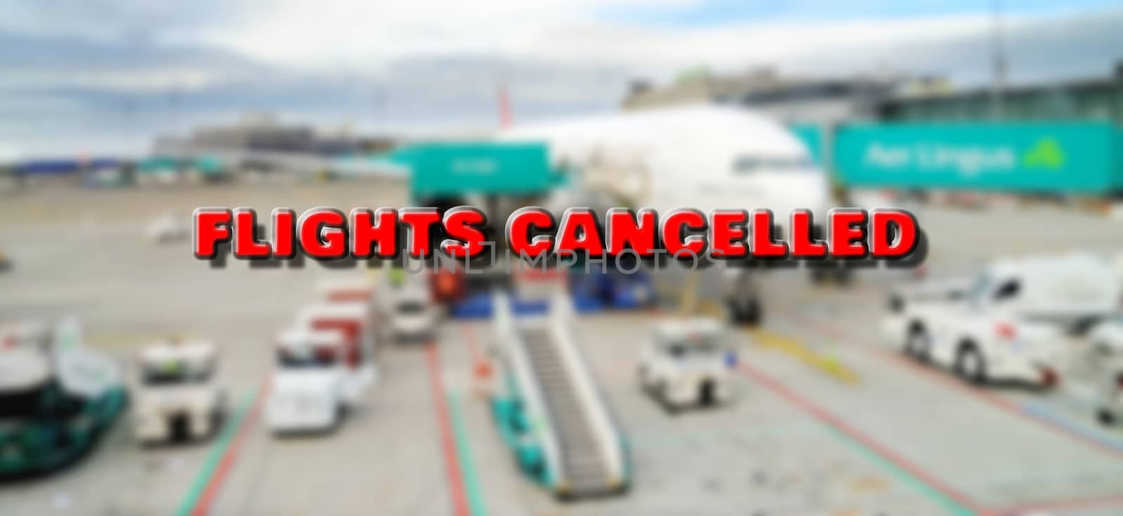 Plane at gate marked with cancelled sign waiting for passengers boarding. According to currently cancelled flights due to world pandemic of coronavirus.