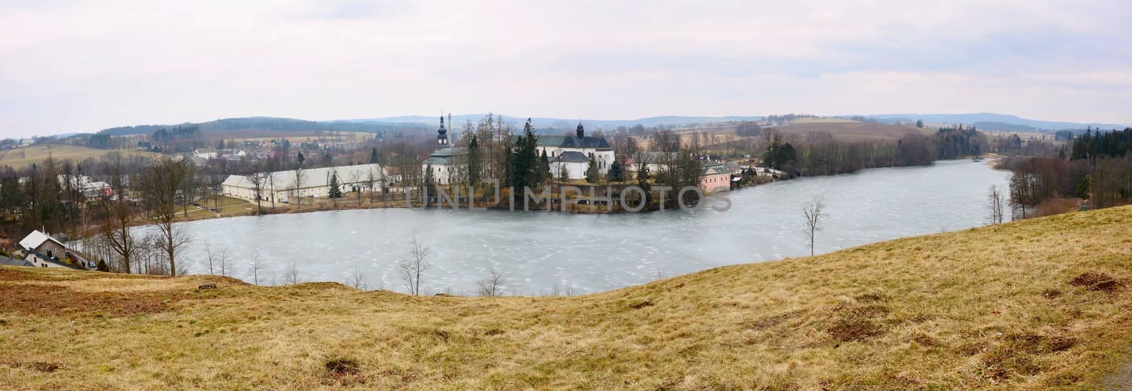 Wide Angle Landscape Shot of a Basilica of the Assumption of the Virgin Mary and St. Nicholas and Konvent Pond near Zdar nad Sazavou Town. View Above from Hill at Zelena Hora.