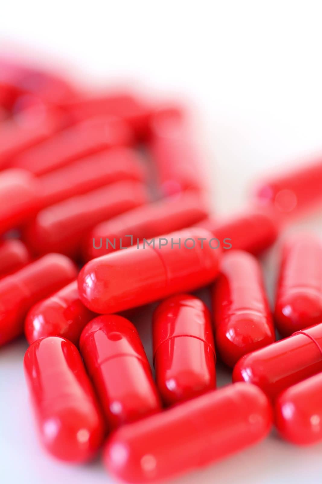 Heap of a red capsules macro by hamik