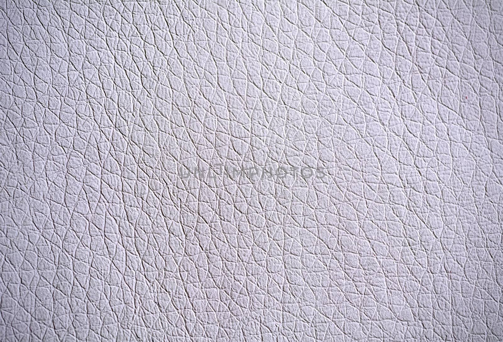 Full frame background of pebbled grey leather surface.