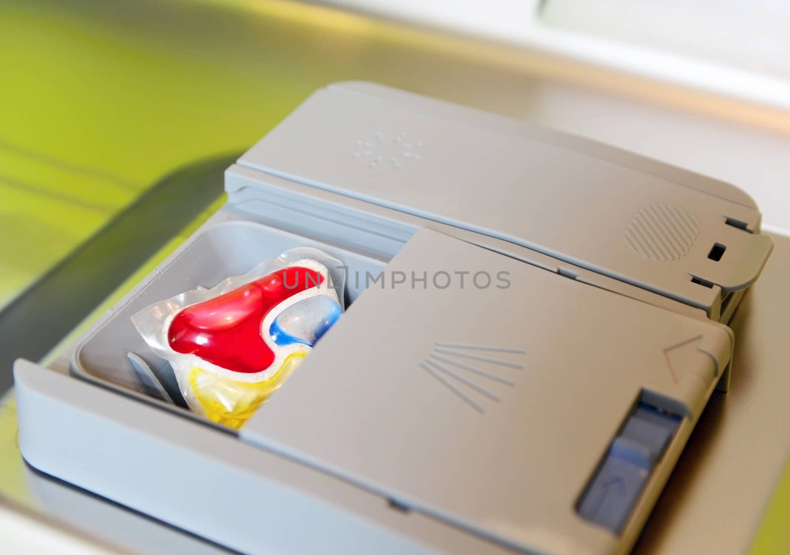 Detergent tablet in dishwasher tray. by hamik