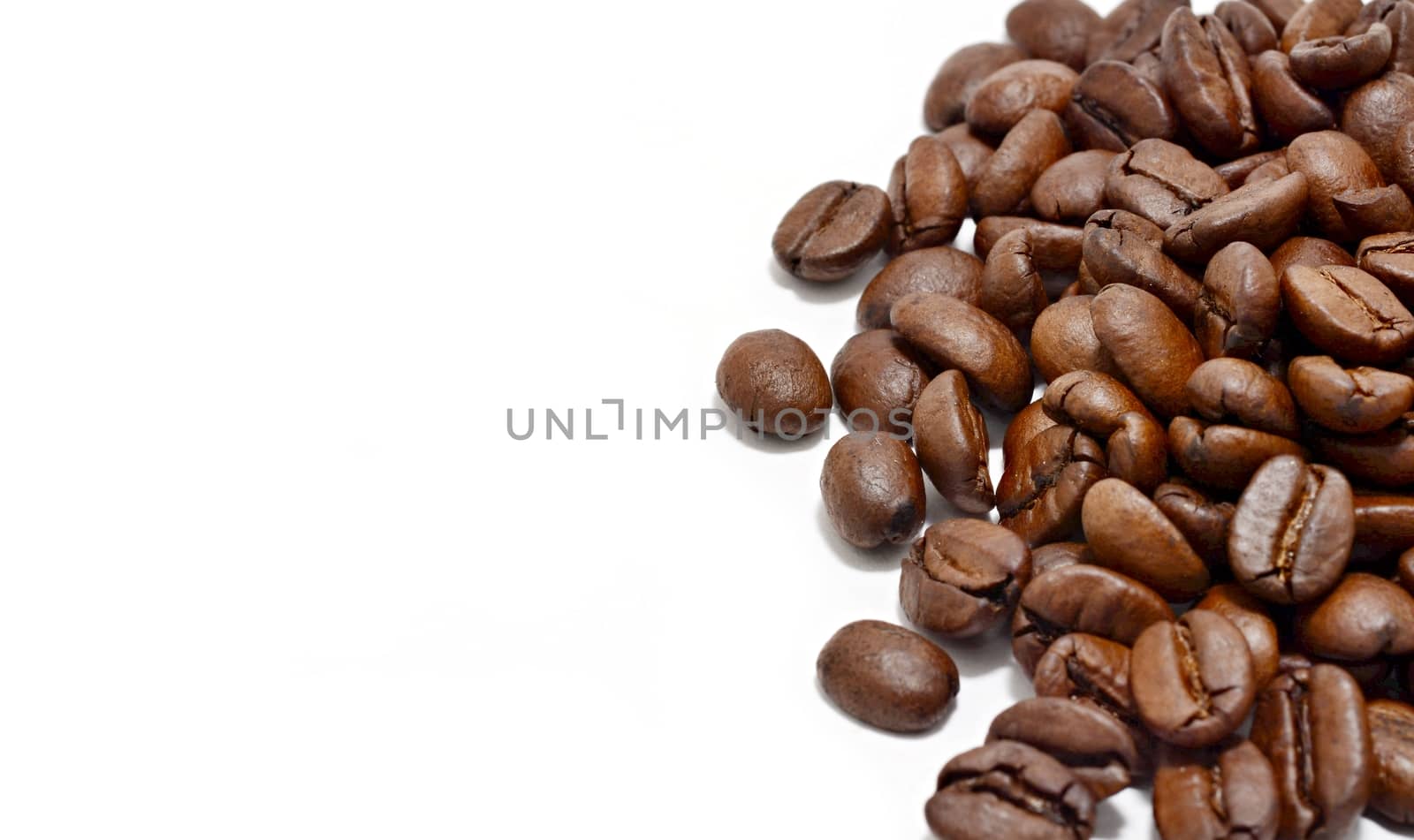 Heap of coffee beans on white background. by hamik