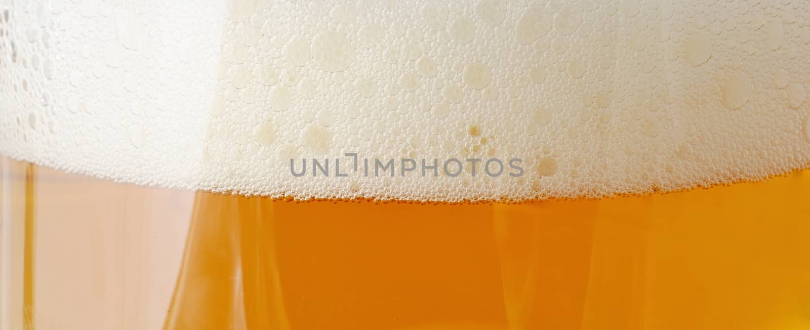 Beer with foam closeup. by hamik