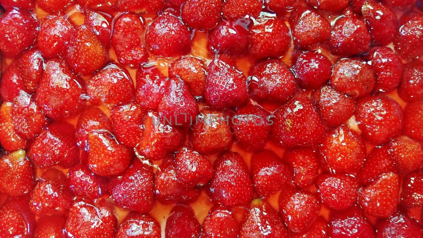 Top down view on structure of strawberry cake with jelly.