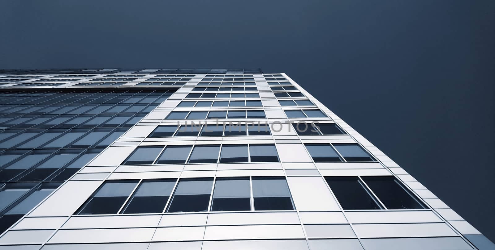 Abstract low angle view of commercial building. by hamik