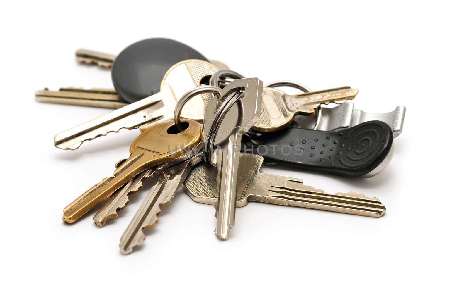 Big bunch of keys and chips over white background.