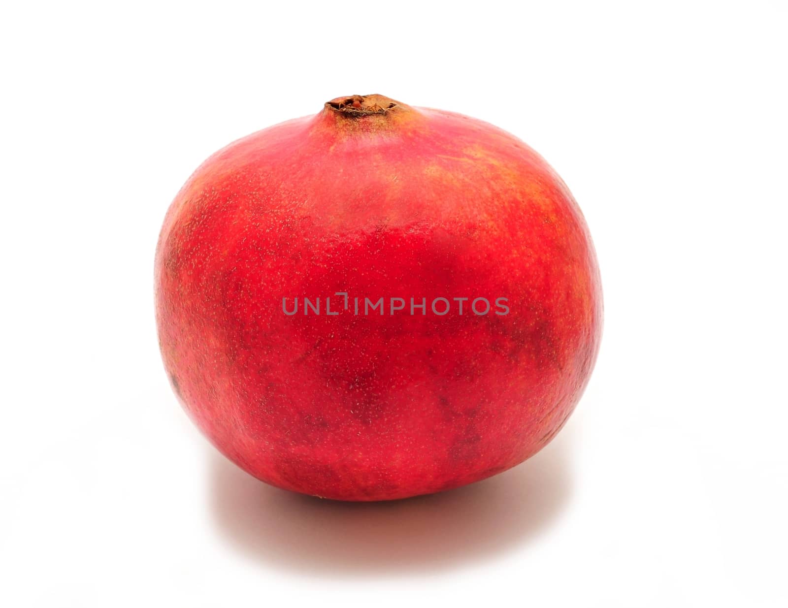 Whole pomegranate on white background by hamik