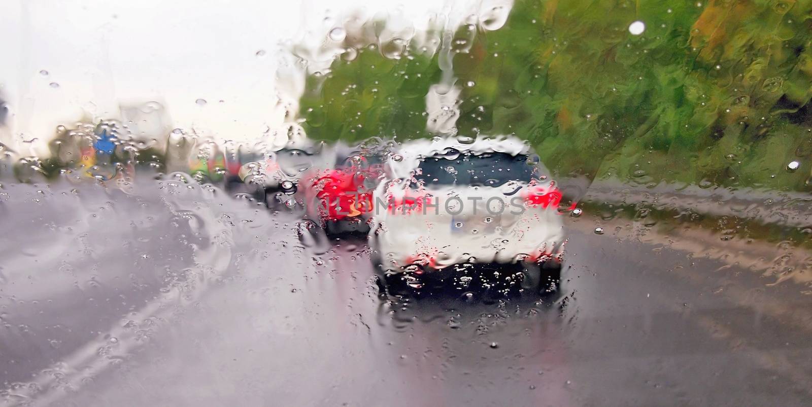 Driving a car in the rain storm by hamik