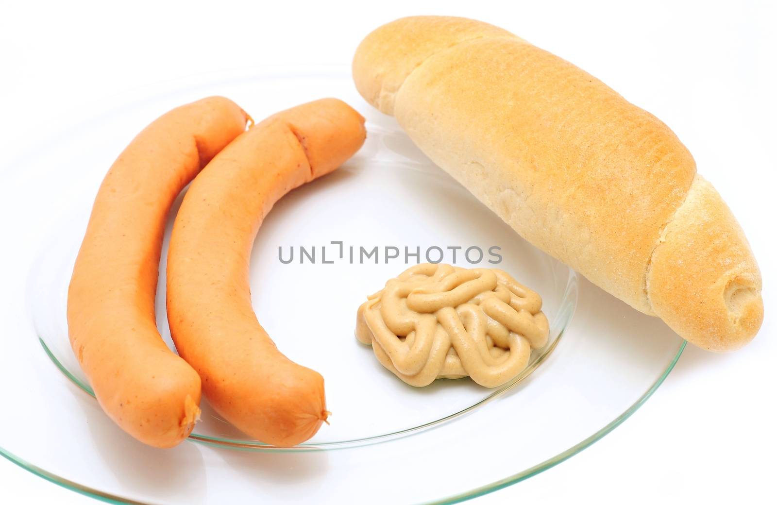 Two frankfurter sausages with mustard and bread roll by hamik