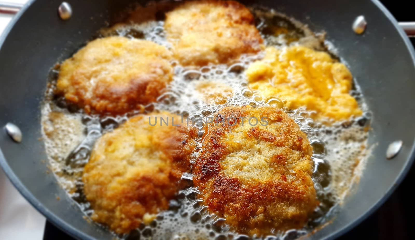 Closeup of Frying a Pork Minced Meat Steak Stuffed with Cheese.