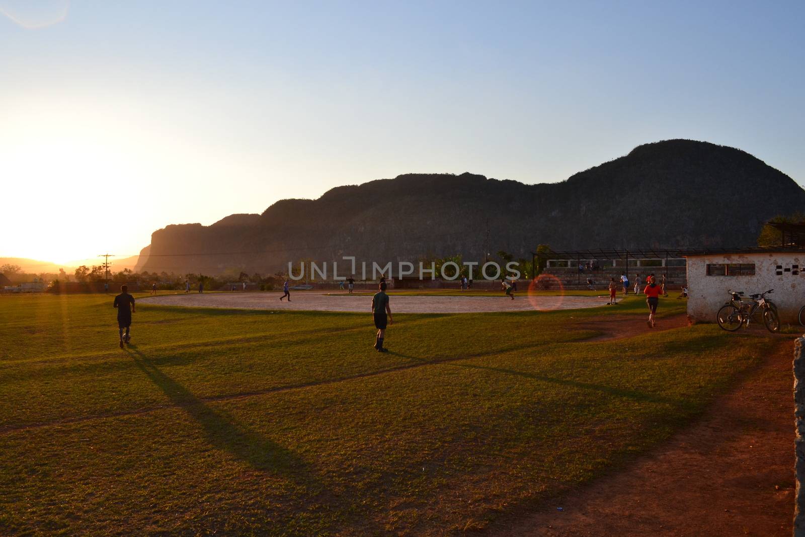 people playing a ball game on a sports field in Vinales, Cuba by kb79