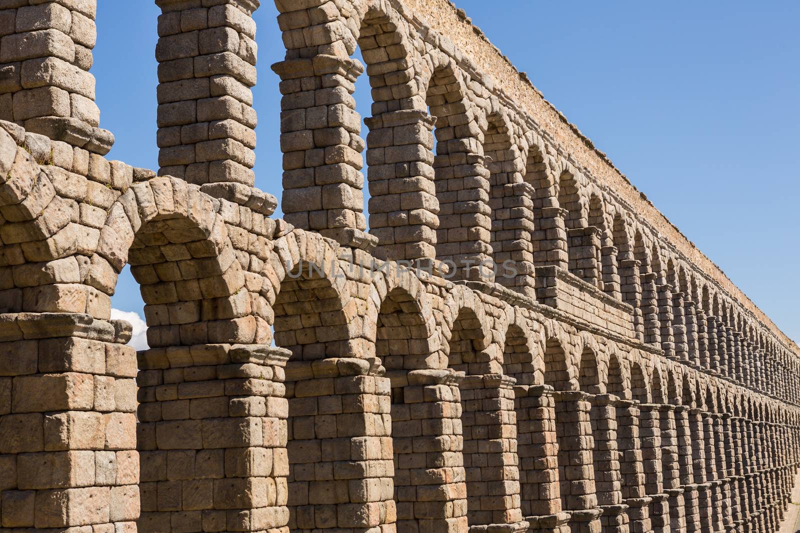 Detail of the Roman Aqueduct, the famous landmark of Segovia, Spain