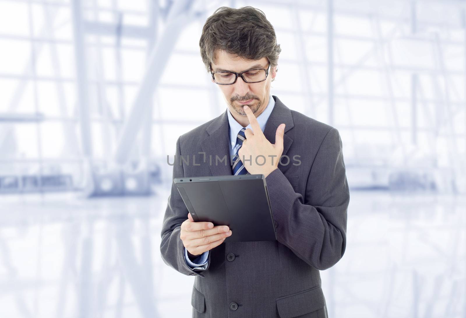 young businessman working with a tablet pc, at the office
