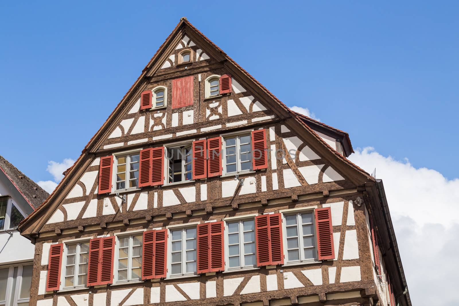 historic half-timbered building made of dark wood with balconies and decorative elements. Tubingen, Baden-Wurttemberg, Germany.