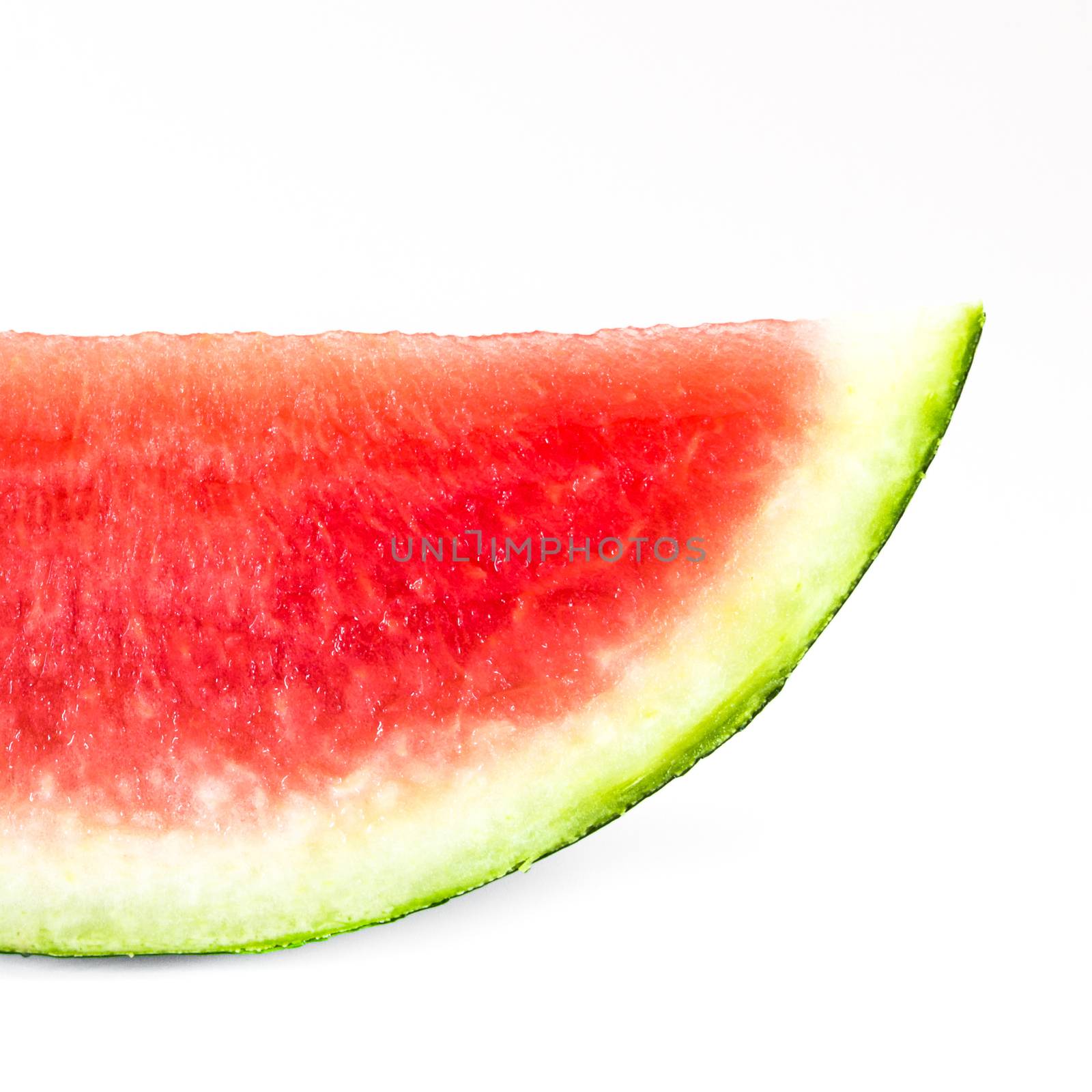 A slice of ripe watermelon, isolated on white background.