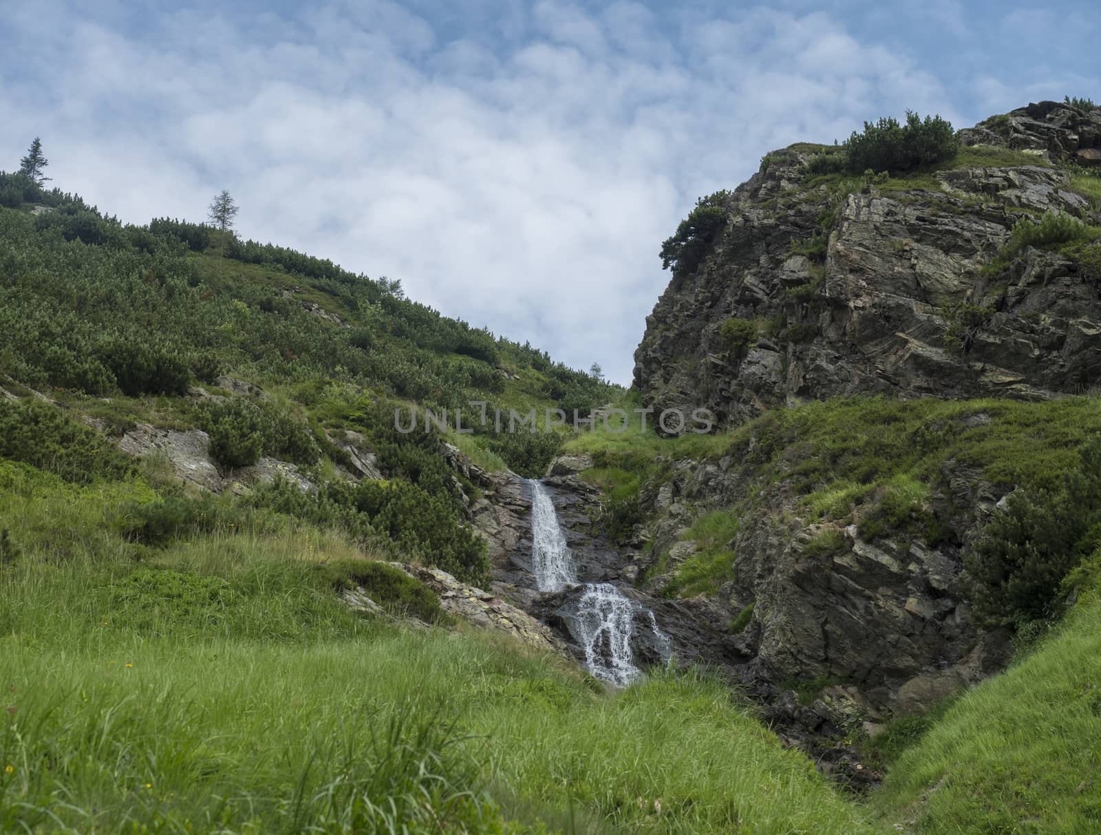 Sarafiovy vodopad waterfall in Beautiful summer mountain landscape near Ziarska chata in Ziarska dolina valley in Western Tatras mountains in Slovakia.