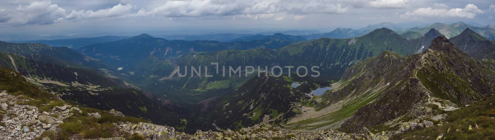 Panoramic view from Banikov peak on Western Tatra mountains or Rohace panorama. Sharp green mountains - ostry rohac, placlive and volovec with hiking trail on ridge. Summer blue sky white clouds. by Henkeova