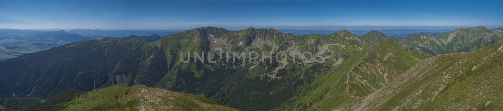 Panoramic view from Baranec peak on Western Tatra mountains or Rohace panorama. Sharp green mountains - ostry rohac, placlive and volovec with hiking trail on ridge. Summer blue sky white clouds. by Henkeova