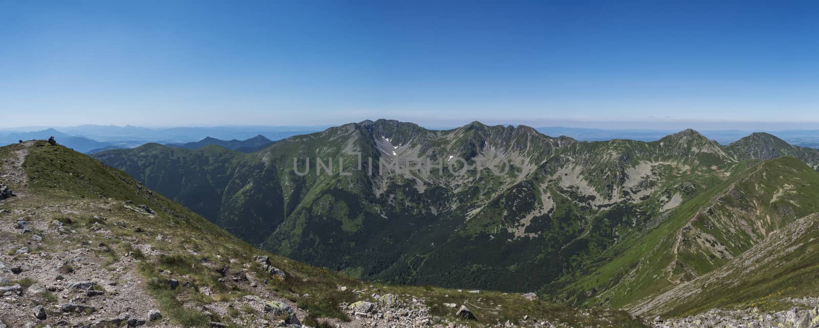 Panoramic view from Baranec peak on Western Tatra mountains or Rohace panorama. Sharp green mountains - ostry rohac, placlive and volovec with hiking trail on ridge. Summer blue sky white clouds. by Henkeova