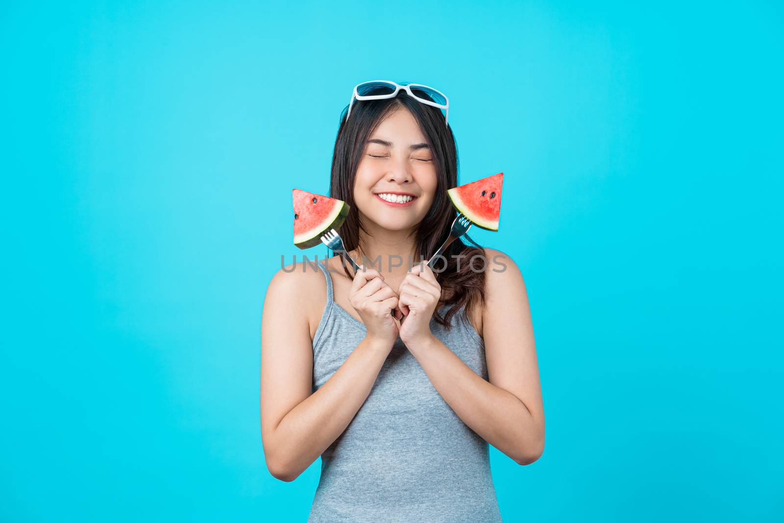 Portrait Attractive Asian young woman holding two Piece slide of by Tzido