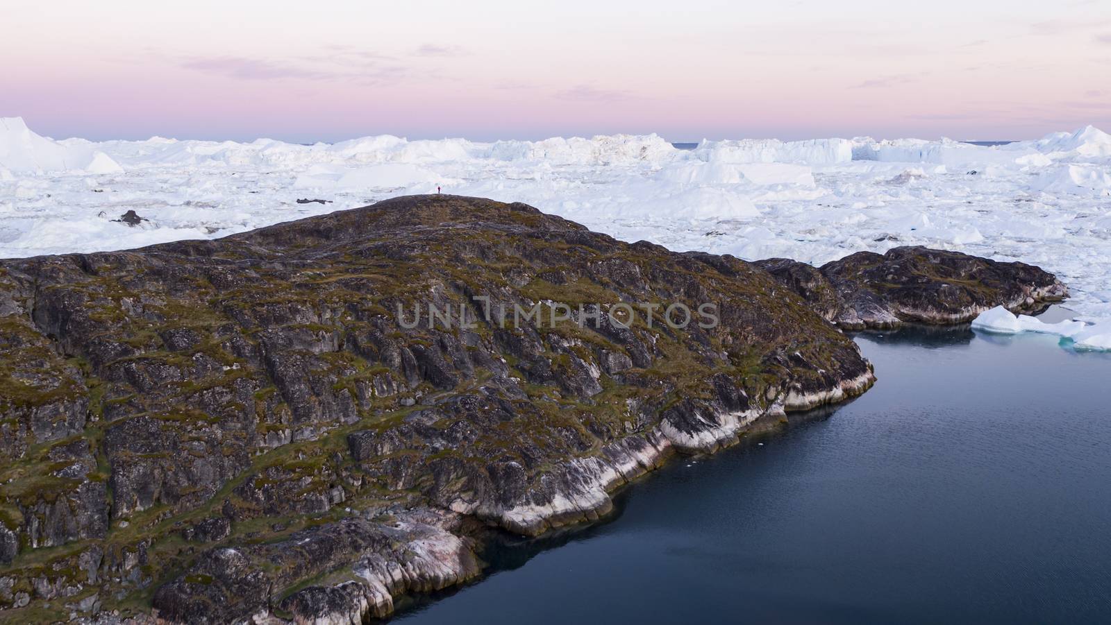 Arctic landscape nature with icebergs and ice in Greenland icefjord. Aerial drone image of ice and iceberg. Ilulissat Icefjord with icebergs from Jakobshavn Glacier aka Sermeq Kujalleq glacier by Maridav