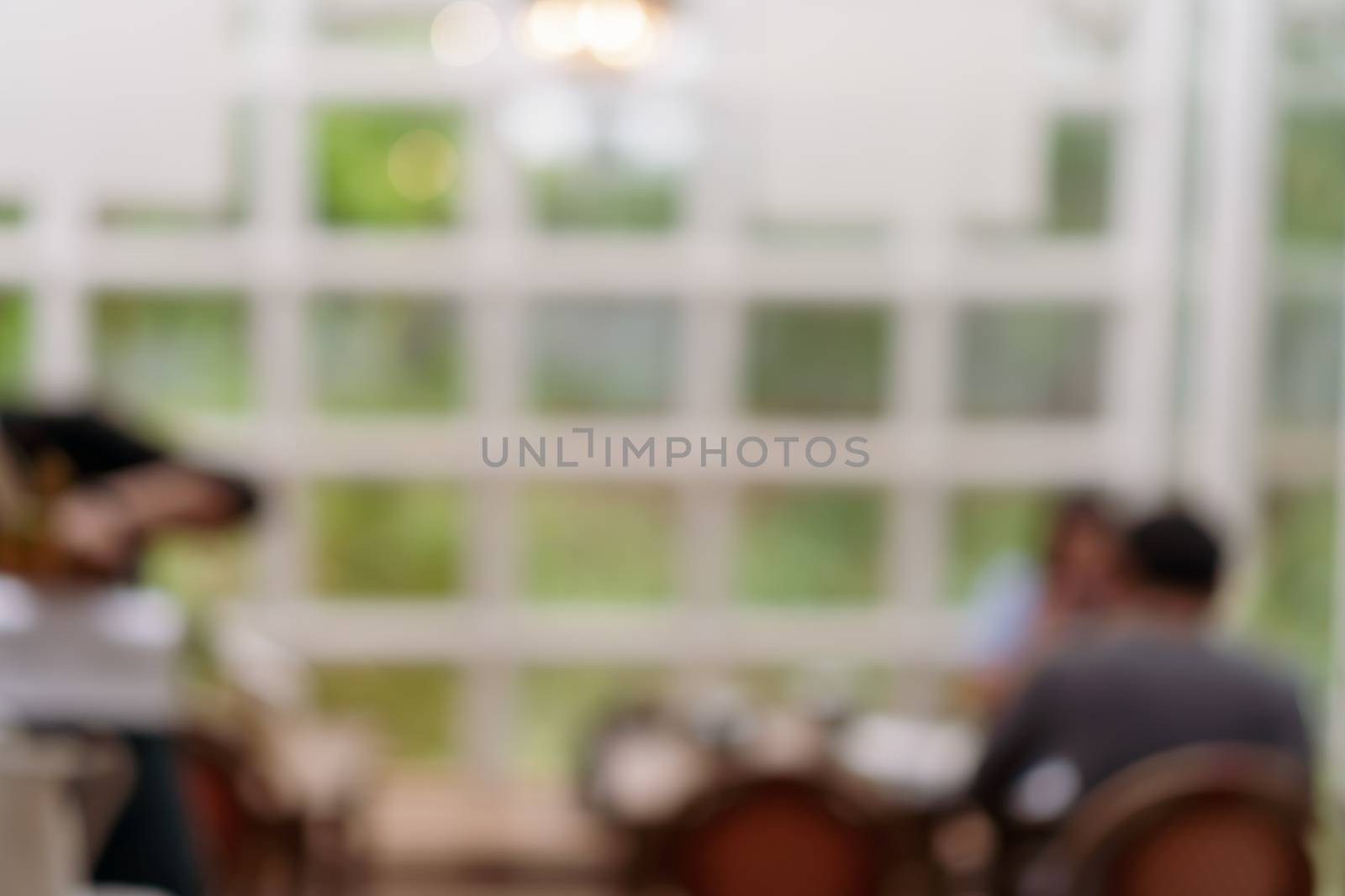 Blur coffee cafe with customers background vintage tone color style. by Suwant