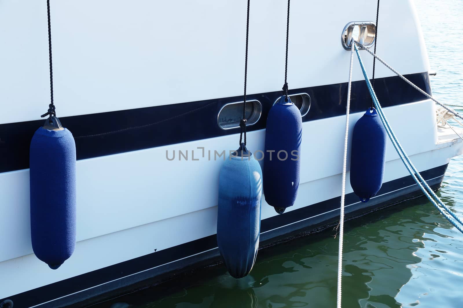 mooring fender on board the yacht close up by Annado