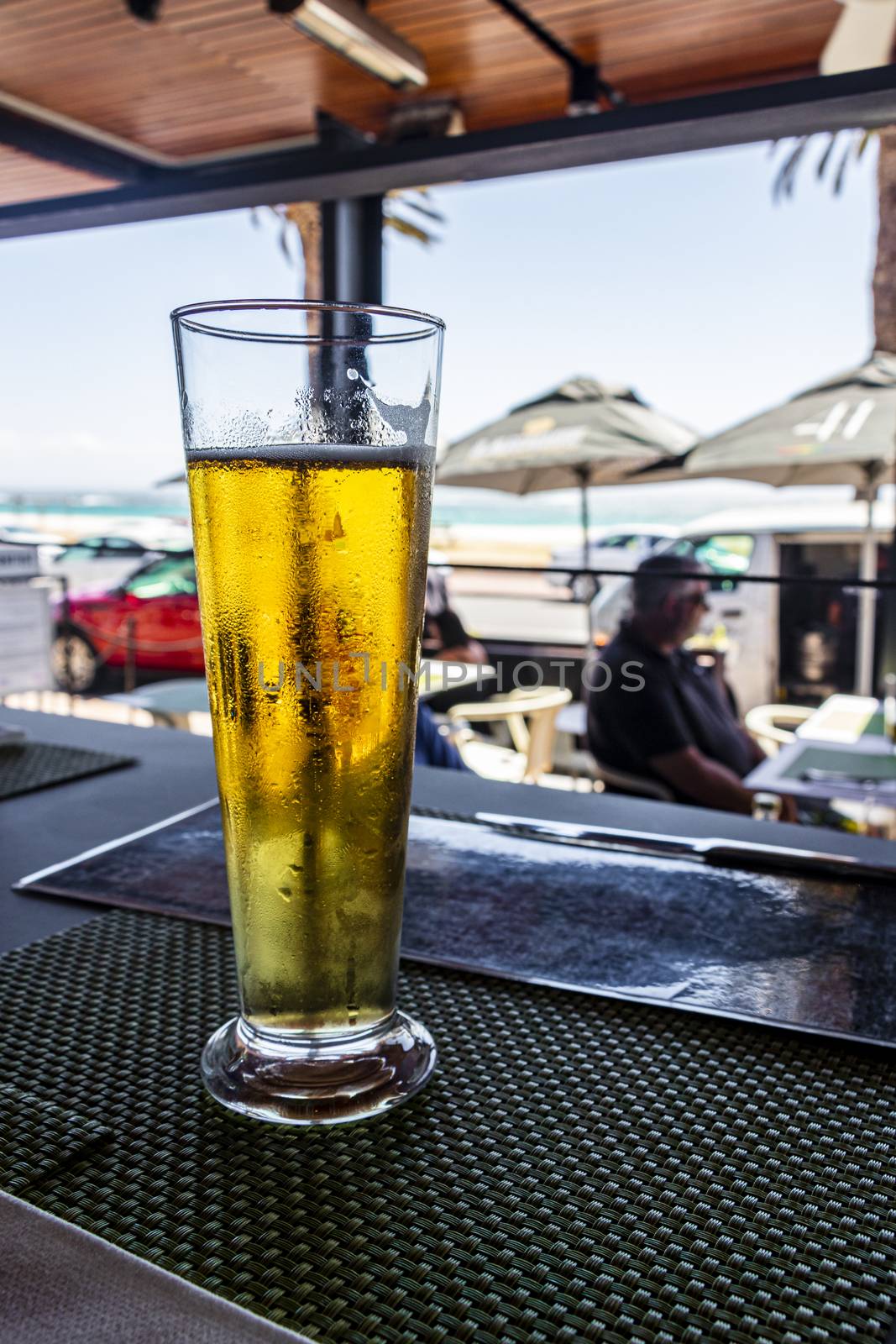 Fresh cold draft beer in a bar in Camps Bay, Cape Town.