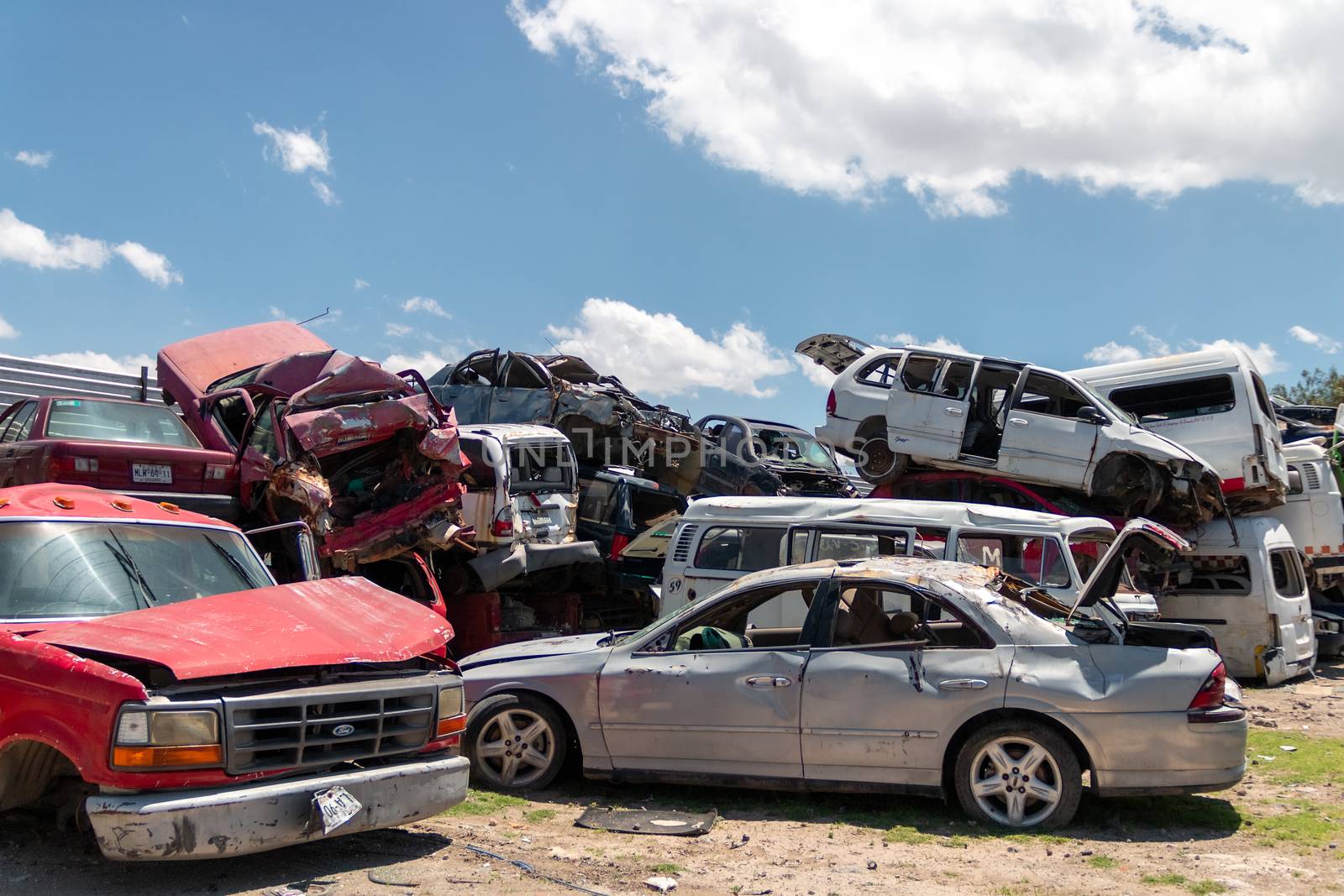 Mexico City / Mexico. June 19 2020: Old Cars Piled up in a Metal Recycling Yard Waiting to be Dismantled and Crushed. by leo_de_la_garza