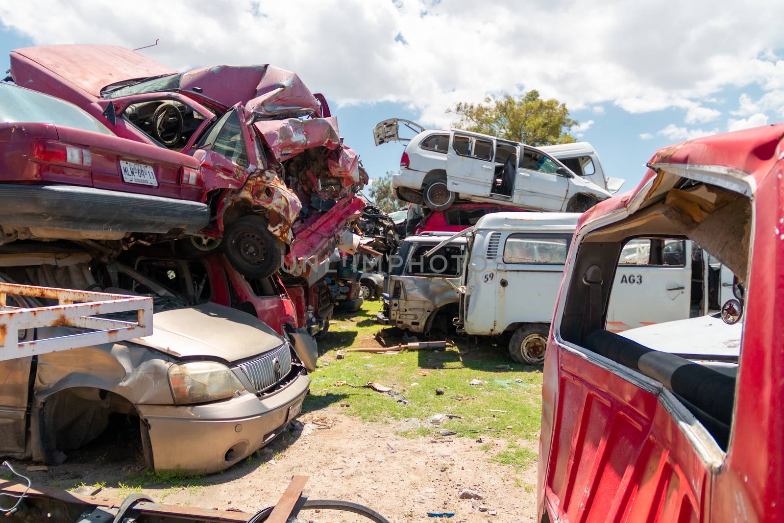 Old damaged cars on the junkyard waiting for recycling in Mexico City. Mexico