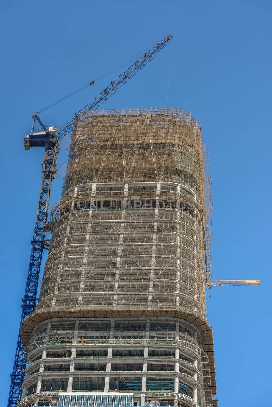 Construction of skyscrapers under blue sky close-up