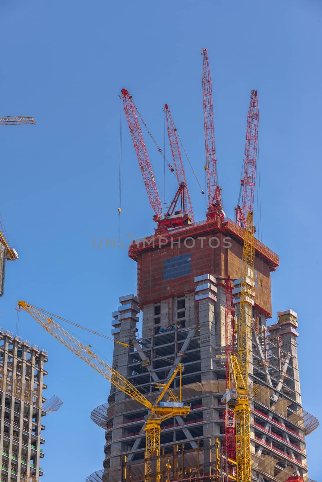 Construction of skyscrapers under blue sky close-up