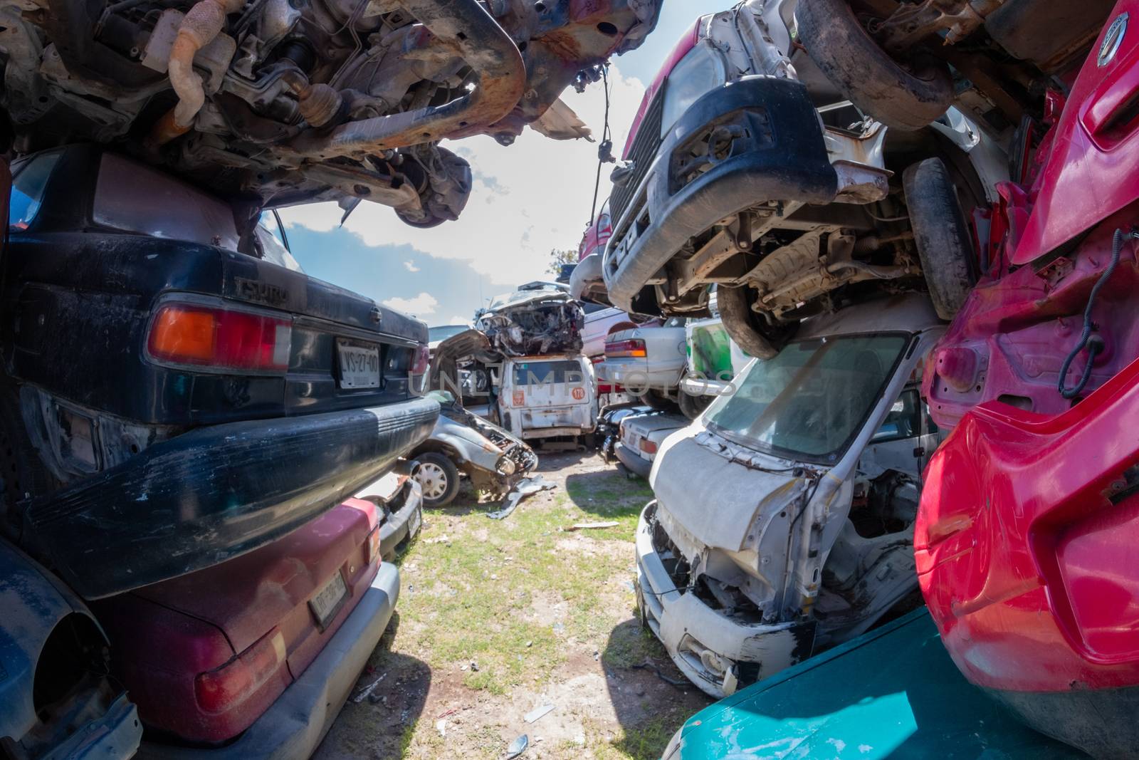 Old damaged cars on the junkyard waiting for recycling in Mexico City. Mexico