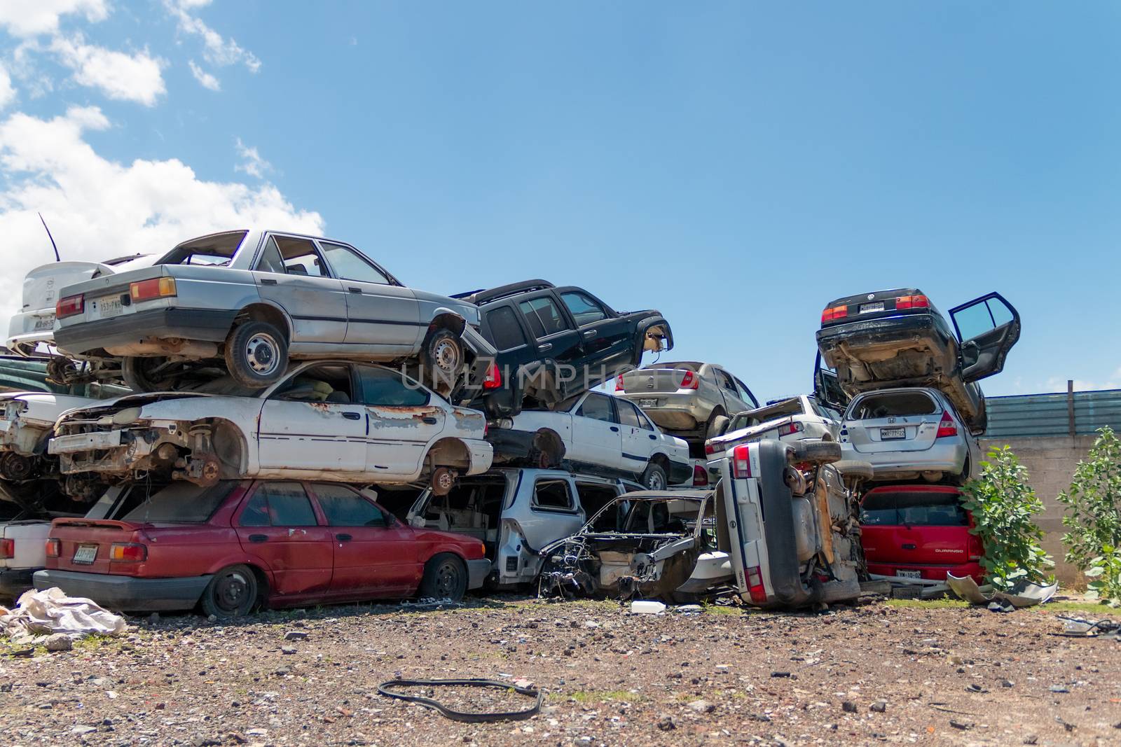 Old damaged cars on the junkyard waiting for recycling in Mexico City. Mexico