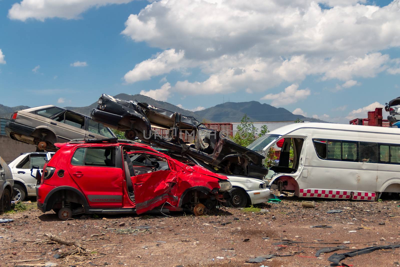 Old damaged cars on the junkyard waiting for recycling in Mexico City. Mexico