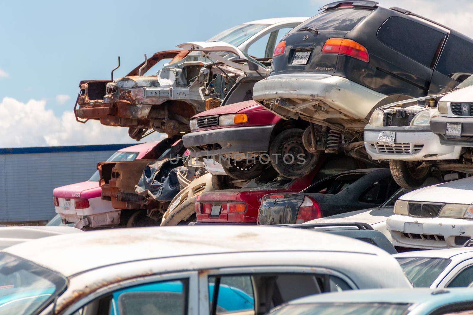 Old damaged cars on the junkyard waiting for recycling in Mexico City. Mexico