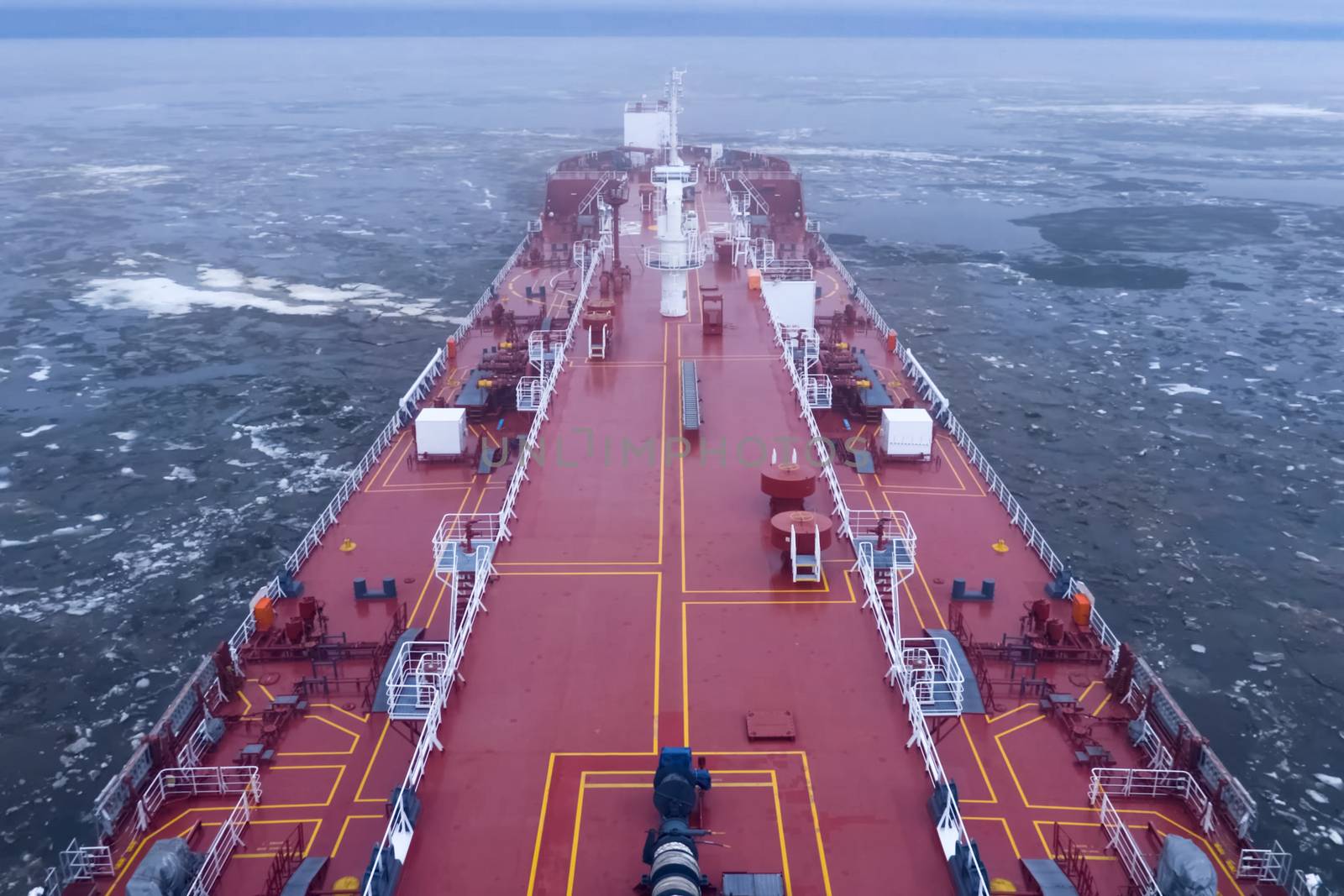 The feed of a ship sailing in the Arctic. Landscape of the Arctic from the deck of the tanker.