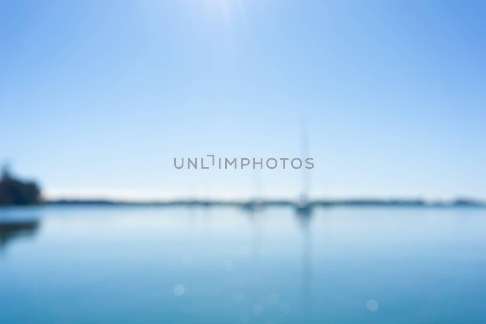 Intentionally defocused for impressionism and background use, boats moored in bay at Omokoroa Tauranga New Zealand from water level perspective.