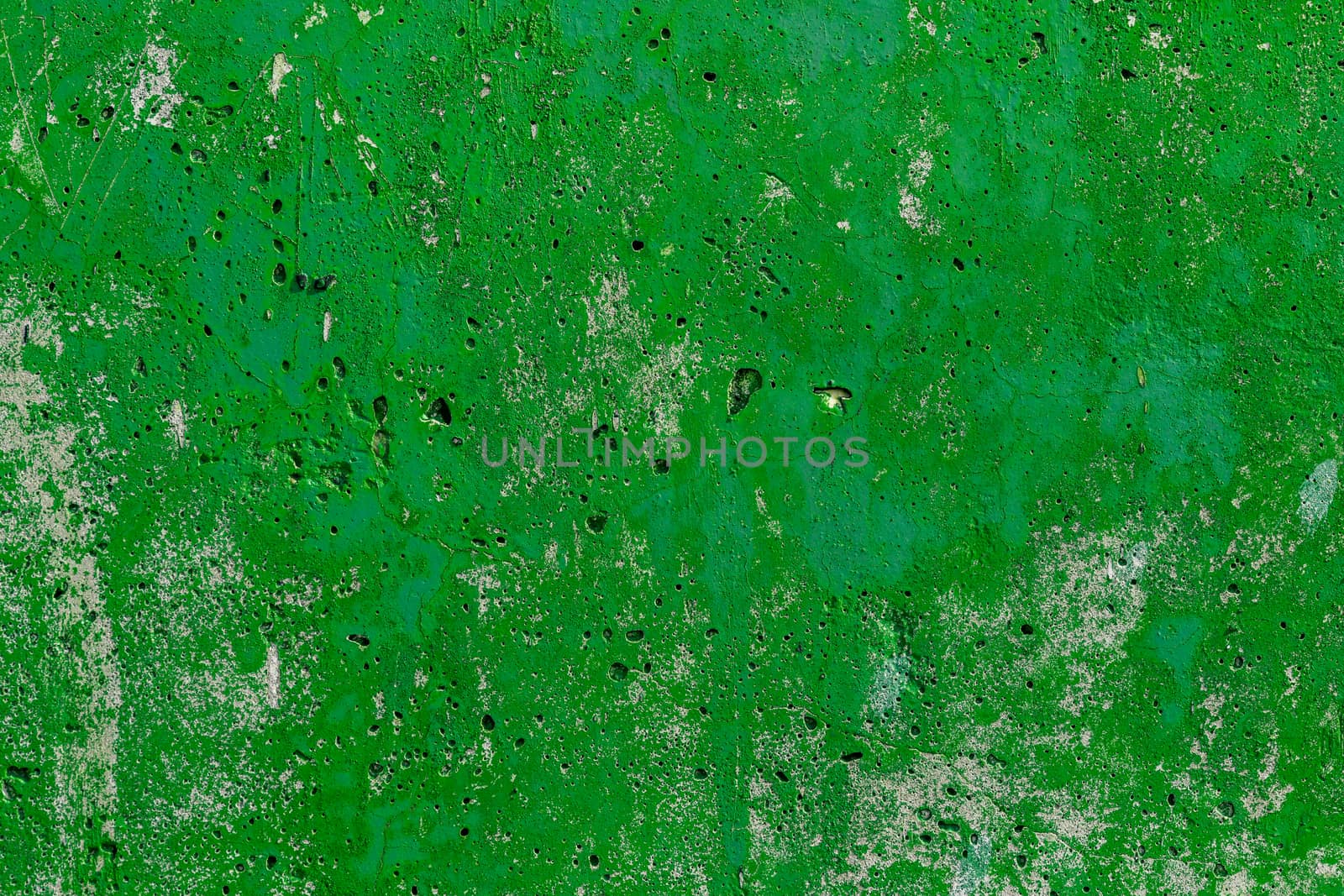 monocolor green painted flat concrete surface closeup texture.