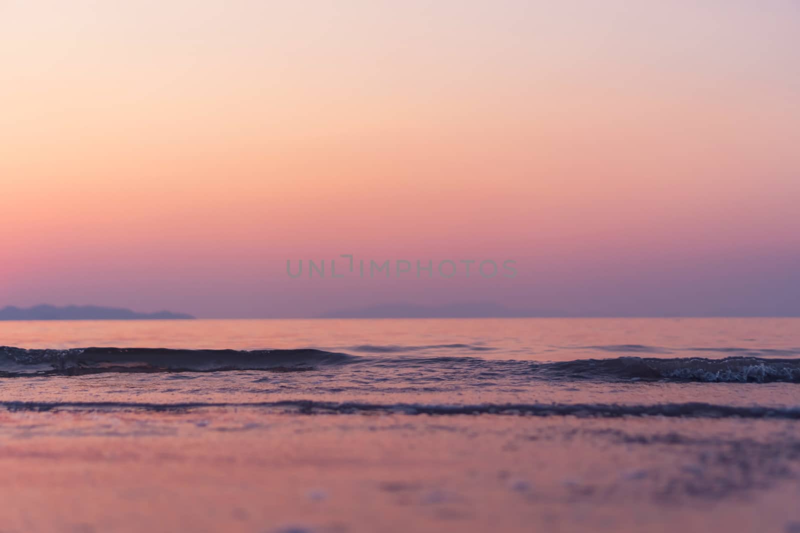 Tropical nature clean beach and white sand in summer with sun light blue sky and bokeh abstract  background.