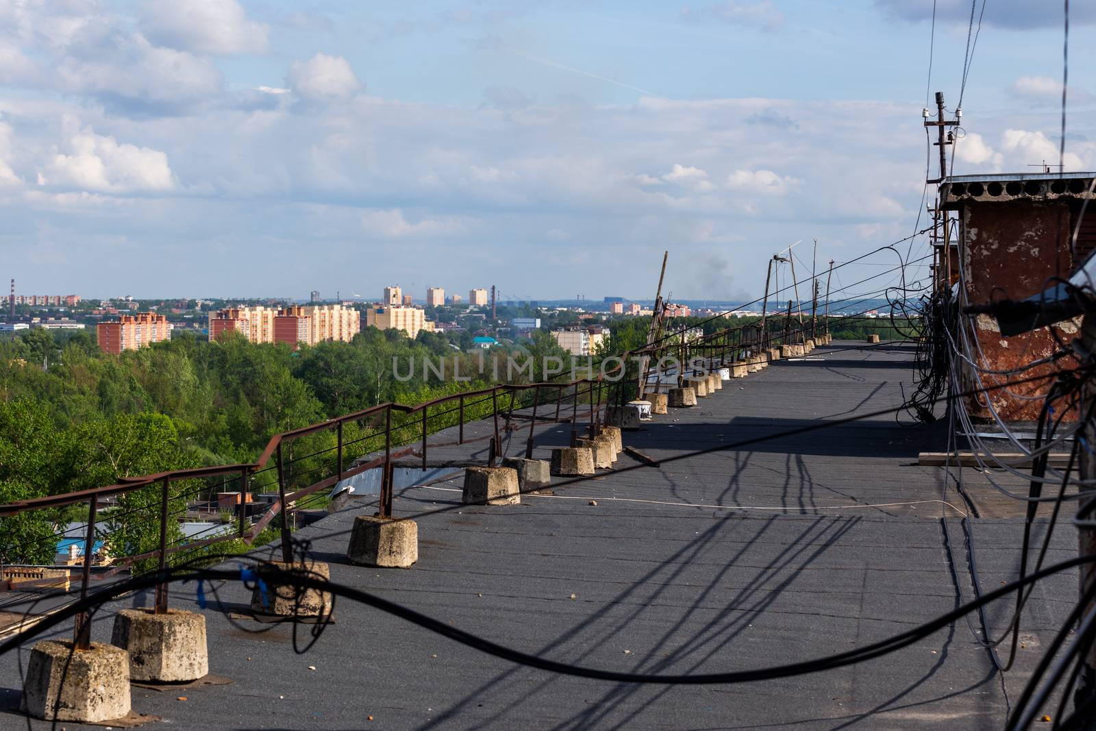 messy cable management on condominium roof at summer daylight with selective focus.