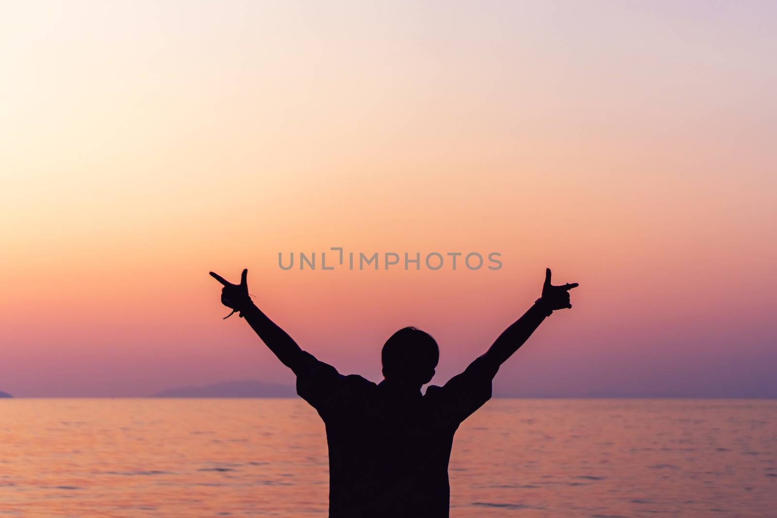 Woman rise hands up to sky freedom concept with blue sky. by Suwant