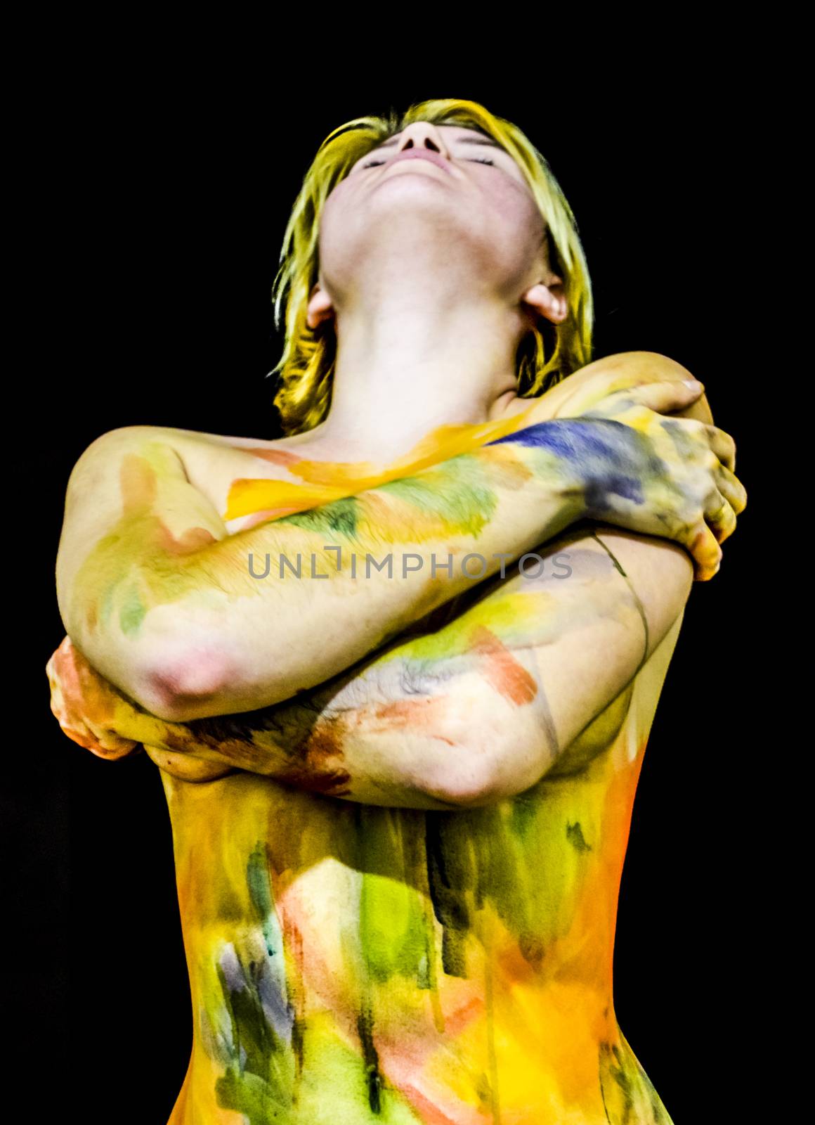 Body art. Drawing on the body. Beautiful girl with painted body watercolors. A white young girl painted the body with paint by eleonimages