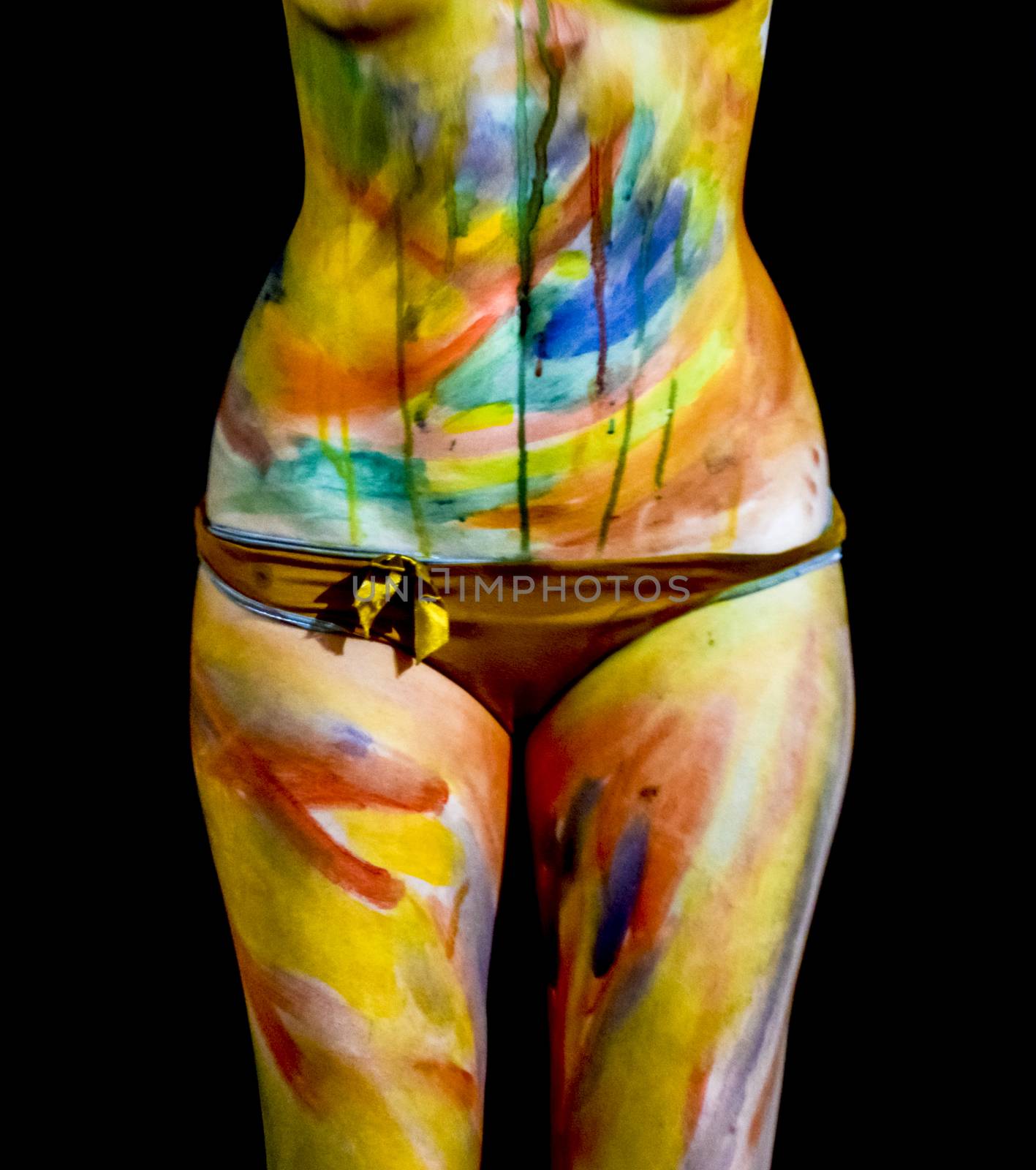 Body art. Drawing on the body. Beautiful girl with painted body watercolors. A white young girl painted the body with paint by eleonimages