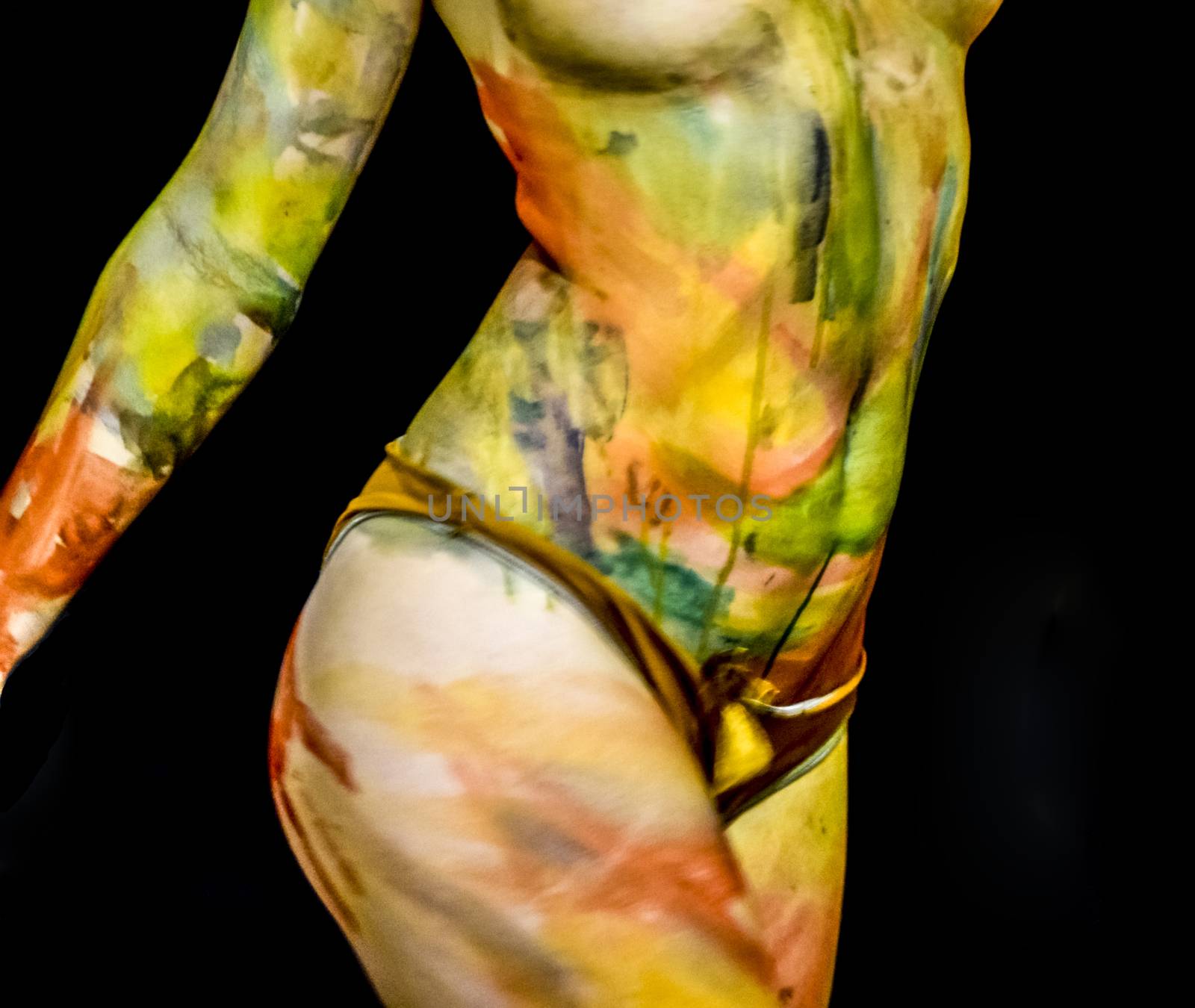 Body art. Drawing on the body. Beautiful girl with painted body watercolors. A white young girl painted the body with paint by eleonimages