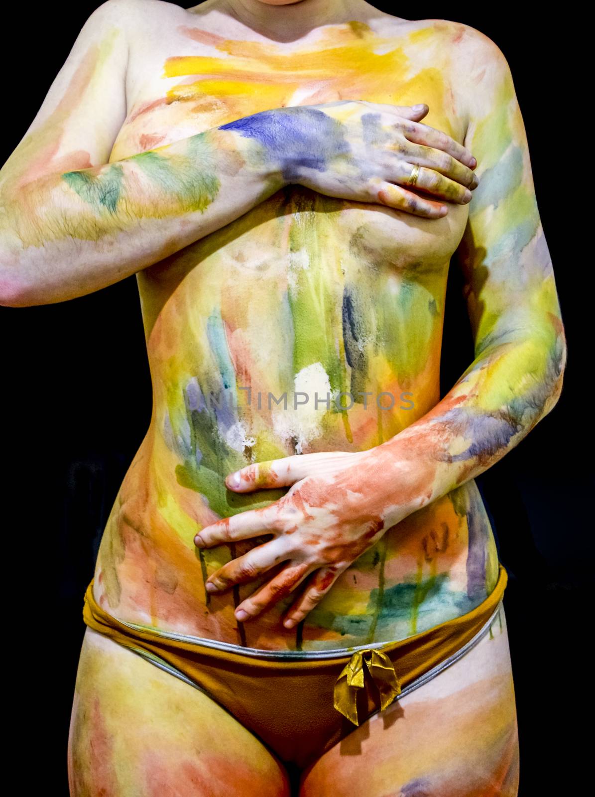 Body art. Drawing on the body. Beautiful girl with painted body watercolors. A white young girl painted the body with paint by eleonimages