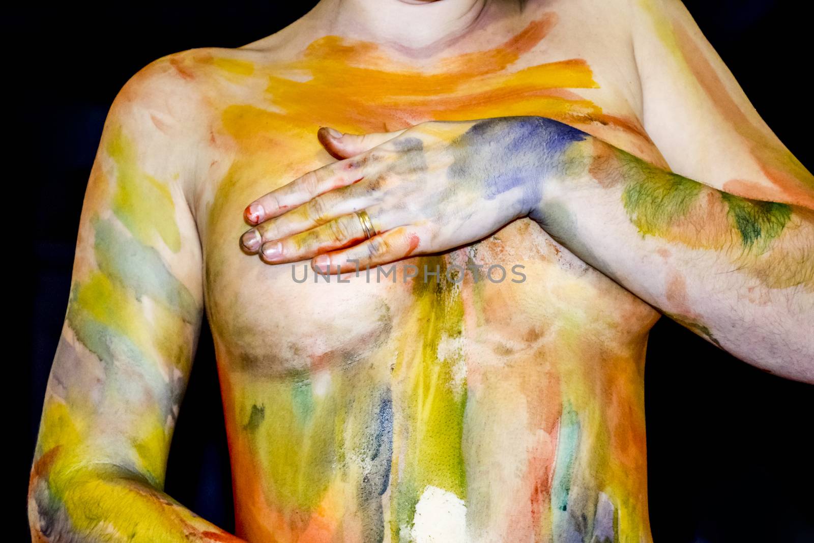 Body art. Drawing on the body. Beautiful girl with painted body watercolors. A white young girl painted the body with paint by eleonimages